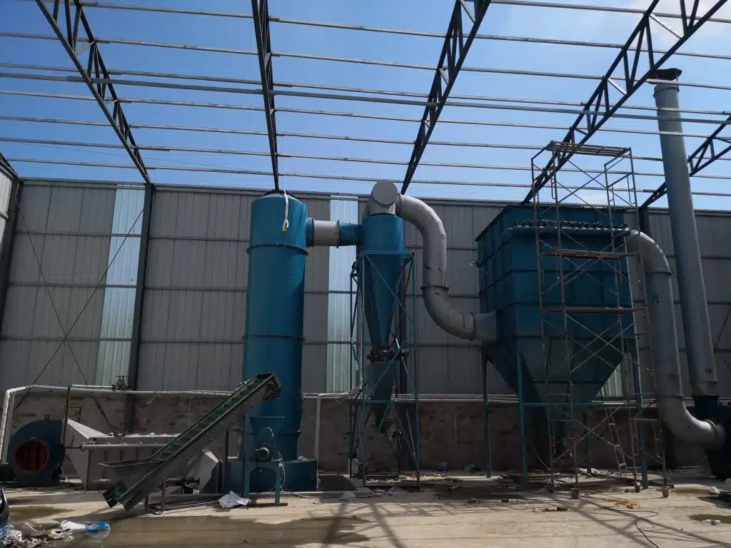 XSG spin flash dryer installed on a customer's factory floor, with cyclone, bag filter and blower